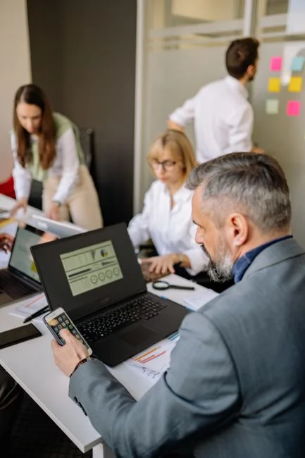 Close-up of various marketing documents on a desk, perfect for business and strategy discussions.